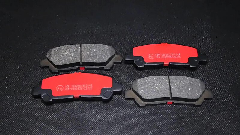 High-performance brake pads showcased at an exhibition with a dark backdrop