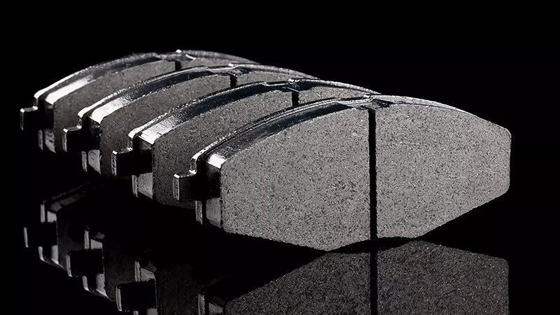 Close-up view of high-performance brake pads with a reflective surface