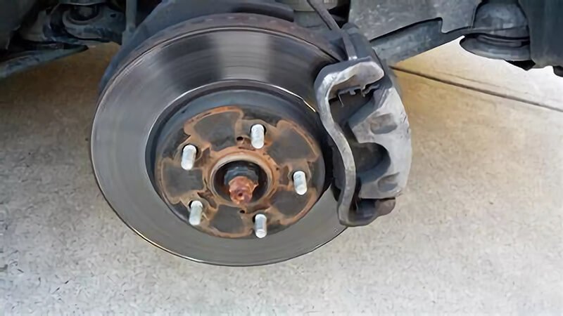 SUV front brake repair in process, emphasizing safety and maintenance