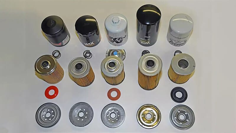 Display of different oil filter brands and their components arranged systematically