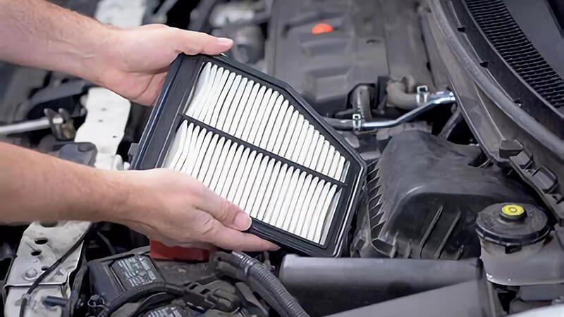 Detailed process of replacing an air filter, essential for improved air quality in vehicles.