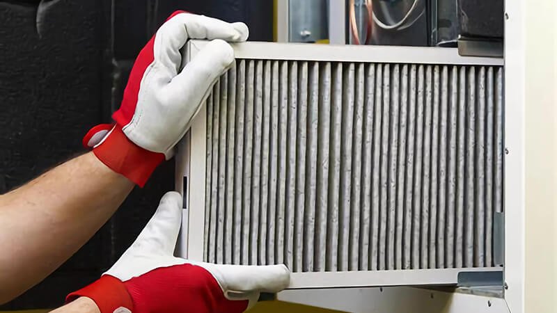 Demonstration of Toyota air filter installation, focusing on superior engine performance.