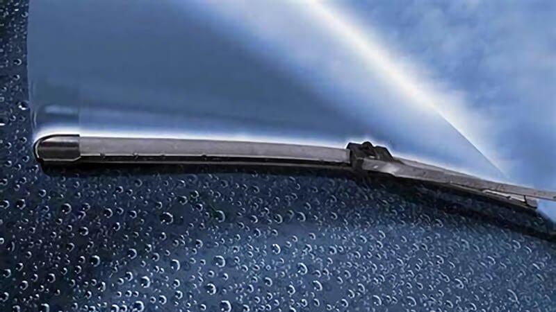Wiper blade clears rainwater from glass